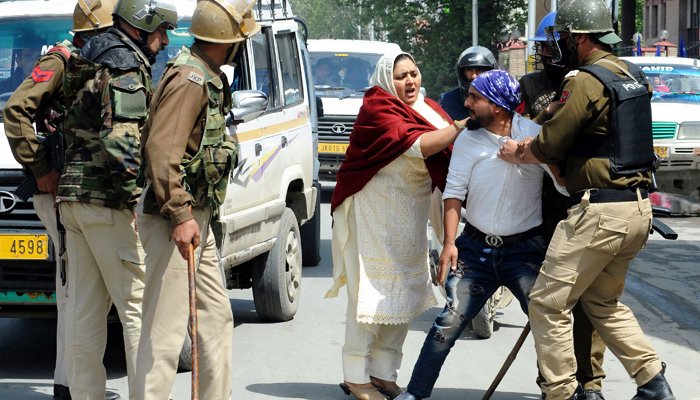 Indian security forces tortured a young Kashmiri before his mother in Sri Nagar.
