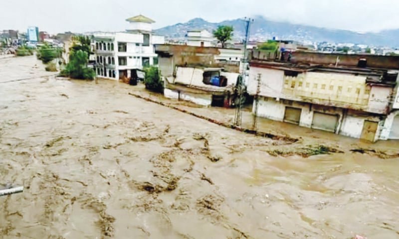 In Swat, a house is destroyed by raging floodwaters