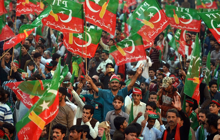 Activists of Imran Khan's party Pakistan Tehreek-i-Insaf (PTI) take part in a Thanksgiving day rally in Islamabad.