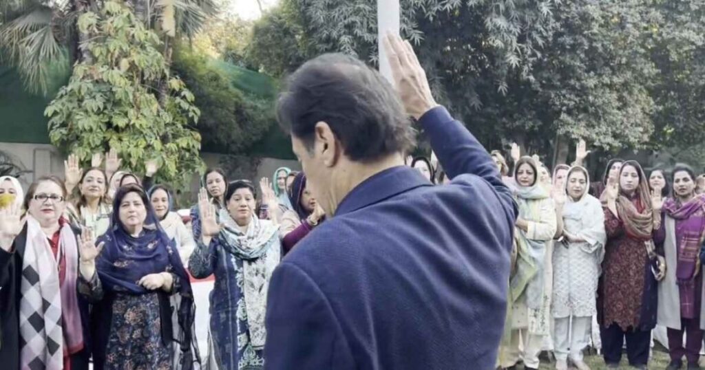 File photo of PTI chairman with PTI women. Imran Khan took an oath from the PTI women for the 'Jail Bharo Movement'.