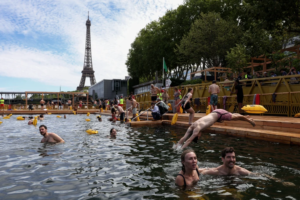 Making a Splash: Parisians Dive Into the Seine After 100 Years