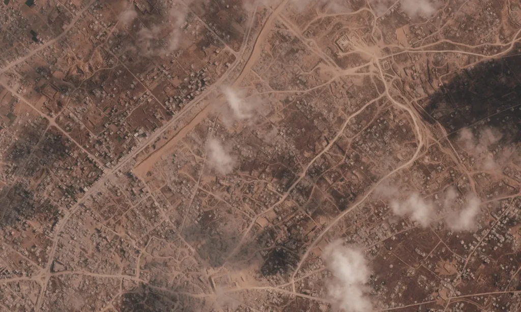 Satellite images show Israel expanding earthen barrier across Gaza
